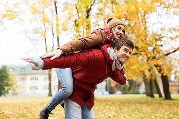 Image showing happy young couple having fun in autumn park