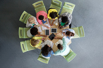 Image showing group of students with tablet pc at school library