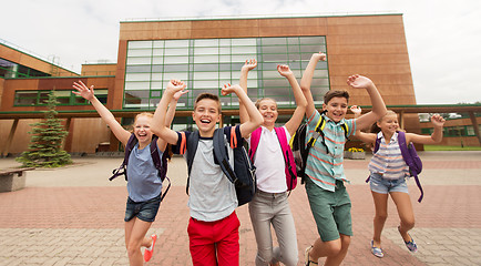 Image showing group of happy elementary school students running