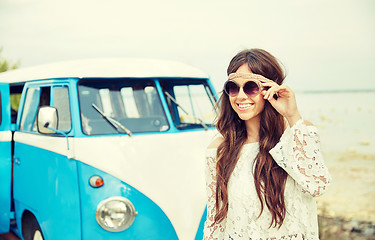 Image showing smiling young hippie woman in minivan car