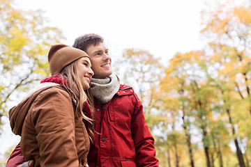 Image showing happy young couple walking in autumn park