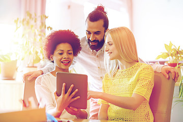 Image showing happy creative team with tablet pc in office