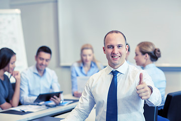 Image showing group of smiling businesspeople meeting in office