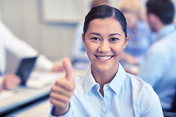 Image showing group of smiling businesspeople meeting in office