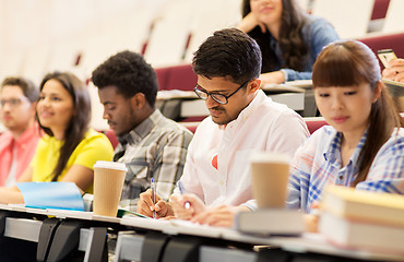 Image showing group of students with coffee writing on lecture