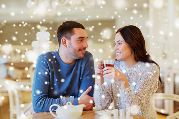 Image showing happy couple drinking tea at cafe