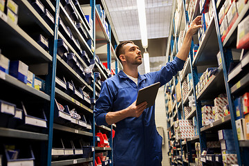 Image showing auto mechanic or smith with tablet pc at workshop