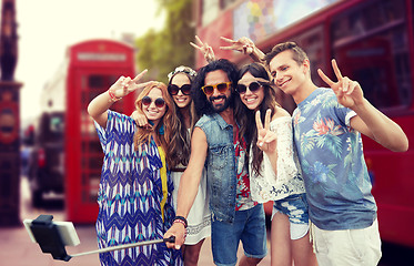 Image showing hippie friends with smartphone on selfie stick