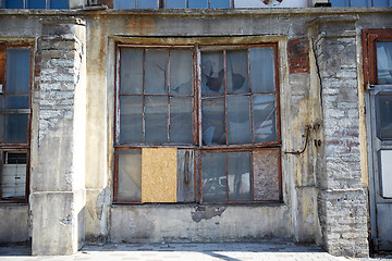 Image showing old industrial building with broken glass window