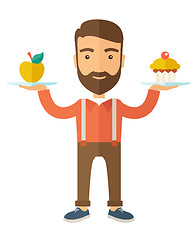 Image showing Man carries with his two hands cupcake and apple.