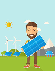 Image showing Man holding a solar panel.