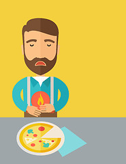 Image showing Man has a stomach burn or abdominal pain after he ate pizza.