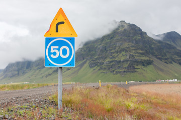 Image showing Curve with advisory speed limit