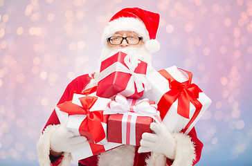 Image showing man in costume of santa claus with gift boxes