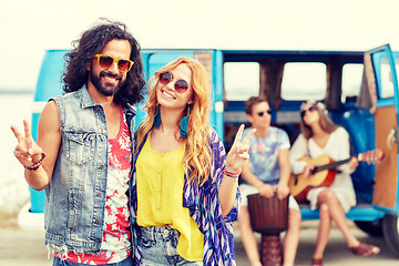 Image showing hippie friends over minivan car showing peace sign