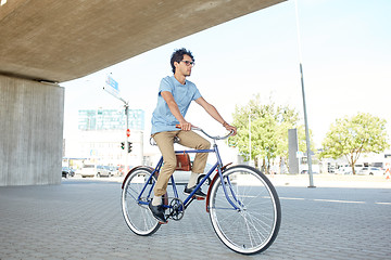 Image showing young hipster man riding fixed gear bike