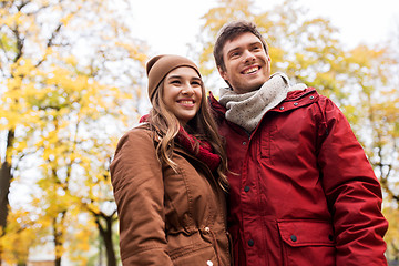 Image showing happy young couple walking in autumn park