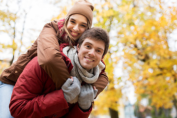 Image showing happy young couple having fun in autumn park