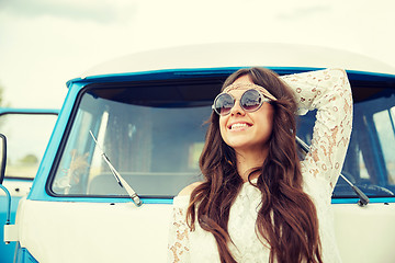 Image showing smiling young hippie woman in minivan car