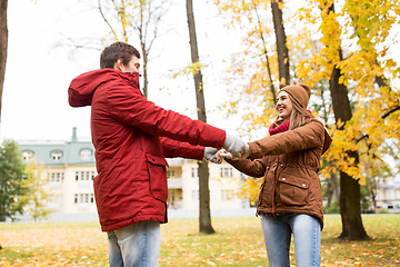 Image showing happy young couple having fun in autumn park