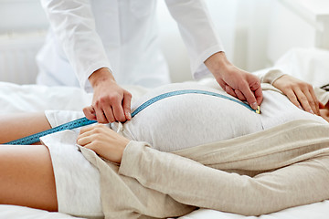 Image showing close up of doctor and pregnant woman at hospital