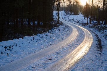 Image showing Sunset by an icy country road