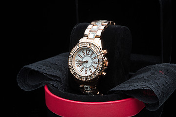 Image showing gold watch isolated on black background