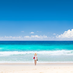 Image showing Woman enjoying picture perfect beach on Mahe Island, Seychelles.