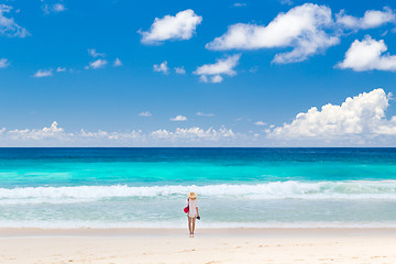 Image showing Woman enjoying picture perfect beach on Mahe Island, Seychelles.