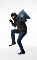 Image showing Thief in mask with bag