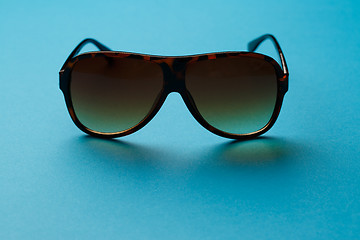 Image showing Sunglasses on blank blue background