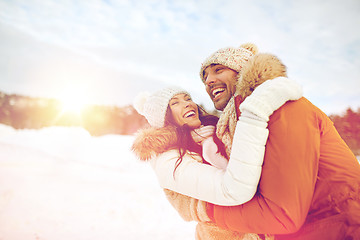 Image showing happy couple hugging outdoors in winter