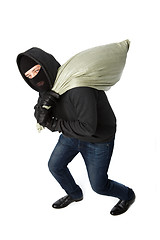 Image showing Thief with heavy black bag