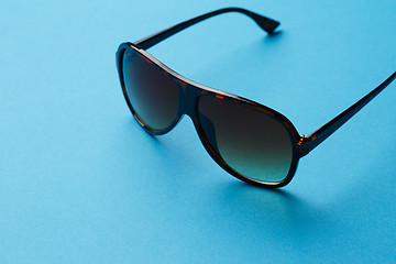 Image showing Sunglasses on empty blue background