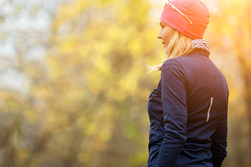 Image showing Girl standing back in forest