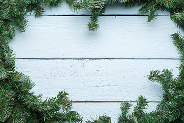 Image showing Christmas and new year blue wooden background with fir tree