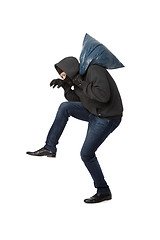 Image showing Robber with bag on shoulder