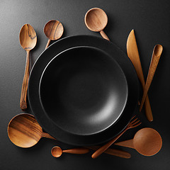 Image showing two plates and wooden cutlery