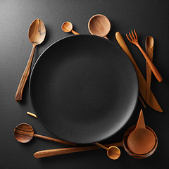 Image showing setting empty plate and wooden cutlery