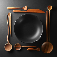 Image showing frame of setting empty plate and wooden cutlery