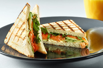 Image showing sandwich with salmon and orange juice for breakfast