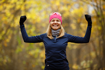 Image showing Young smiling girl doing exercises