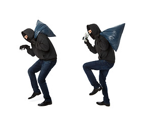 Image showing Two thieves steal with bags