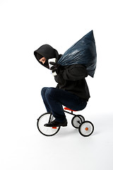 Image showing Burglar goes to small bike