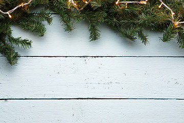 Image showing Christmas, new year wooden background with fir tree and garland