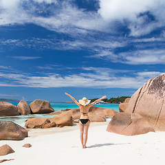 Image showing Woman enjoying Anse Lazio picture perfect beach on Praslin Island, Seychelles.