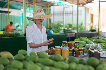 Image showing Traveler shopping on traditional Victoria food market, Seychelles.