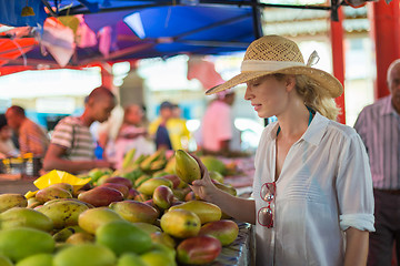 Image showing Traveler shopping on traditional Victoria food market, Seychelles.