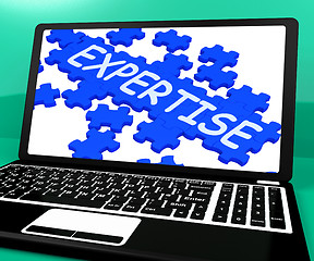 Image showing Expertise Puzzle On Notebook Showing Great Computer Skills