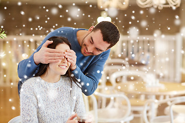 Image showing happy couple drinking tea at cafe